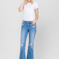 Woman in jeans and white shirt