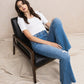 Woman in jeans and white shirt