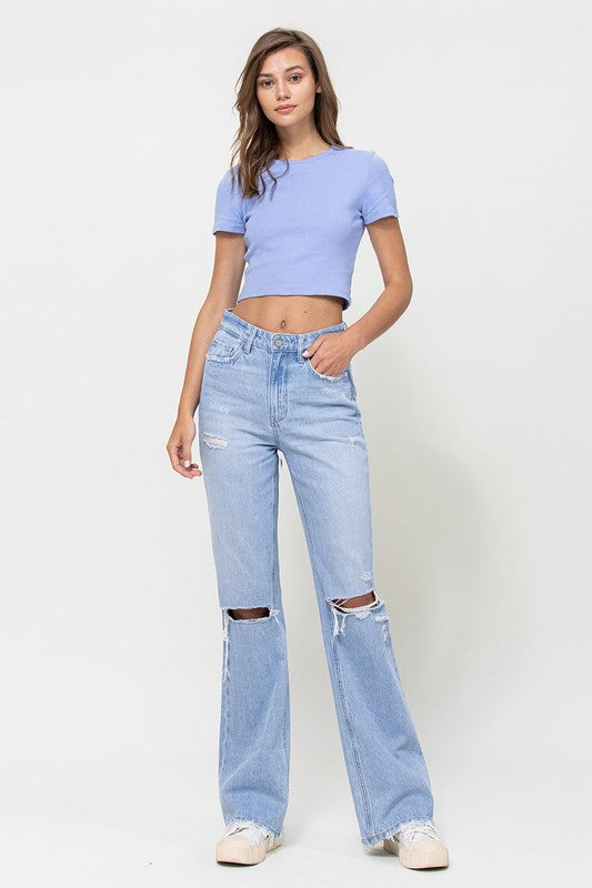  Woman with jeans on standing in front of white background