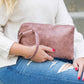 Blush colored clutch