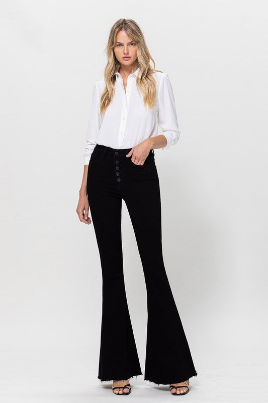 Woman in black jeans and white shirt