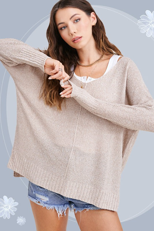 Woman in taupe sweater