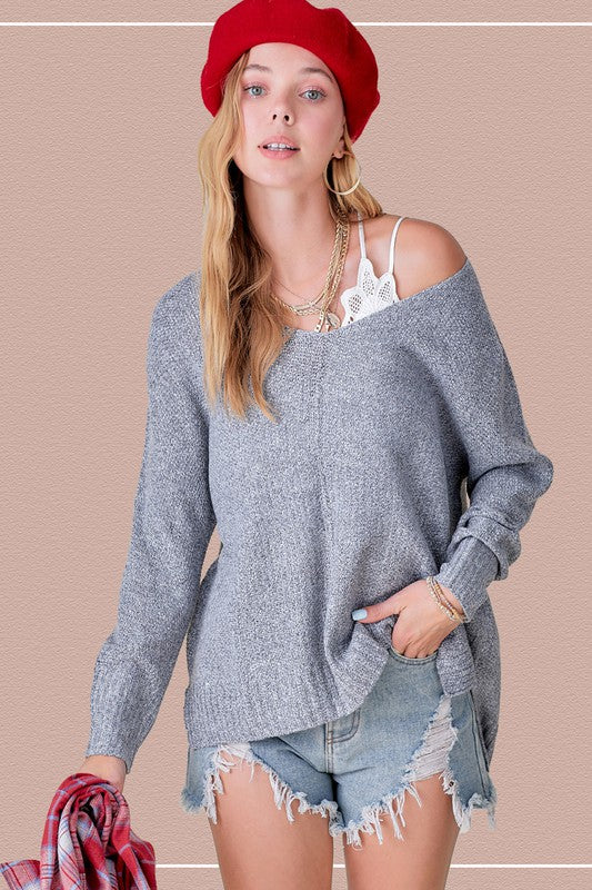 Woman in gray sweater