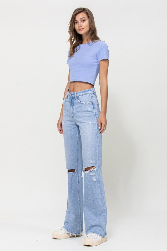  Woman with jeans on standing in front of white background