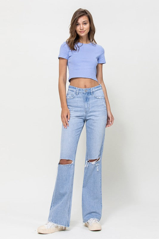  Woman with jeans on standing in front of white background