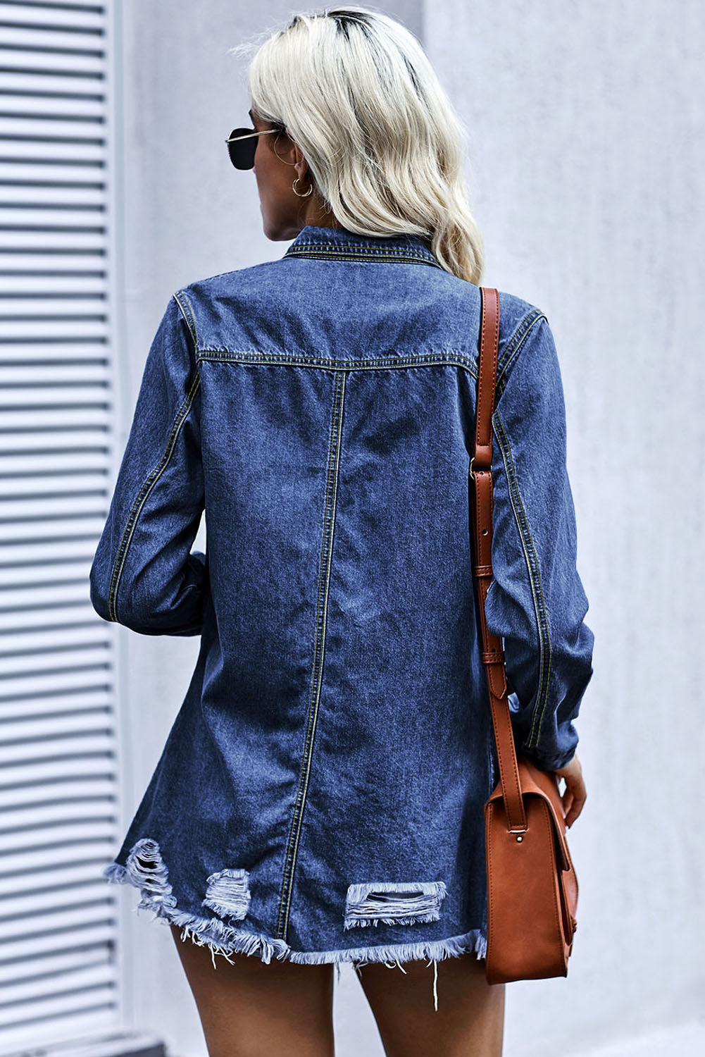 Woman in denim snap down jacket