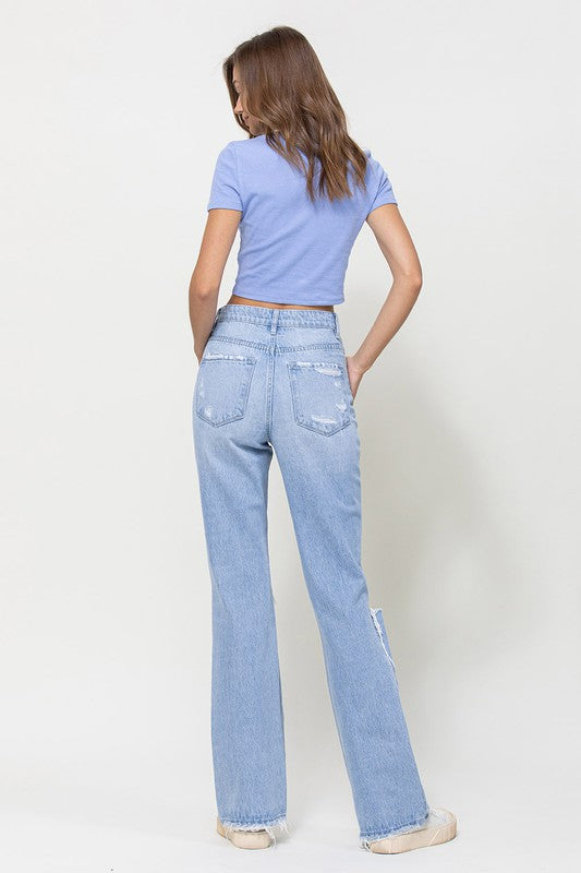  Woman with jeans on standing in front of white background