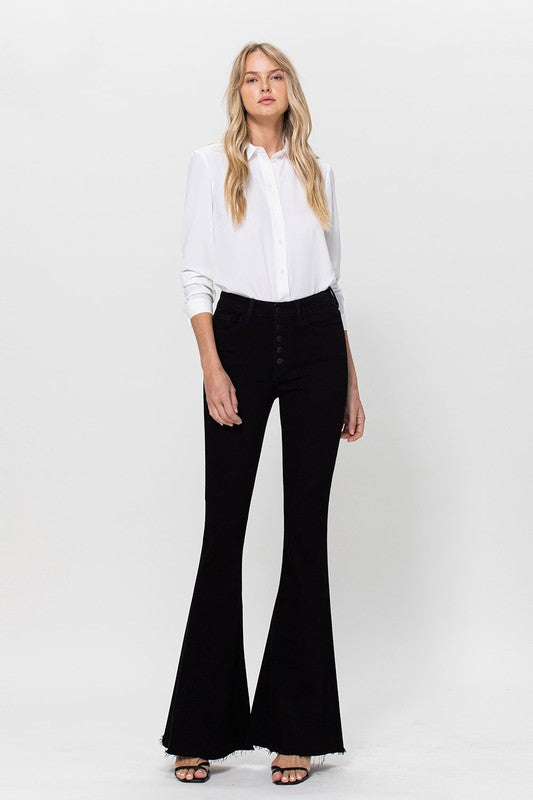 Woman in black jeans and white shirt