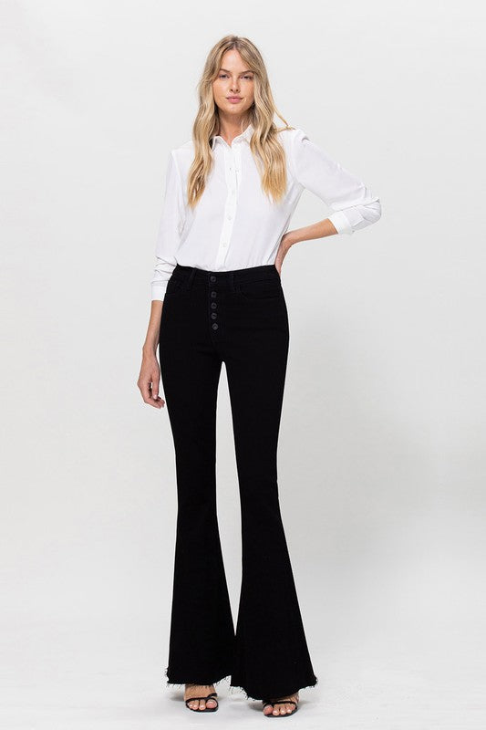 Woman in black jeans and white shirt