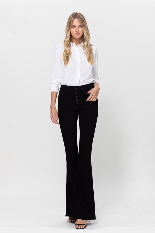 Woman in black jeans and white shirt