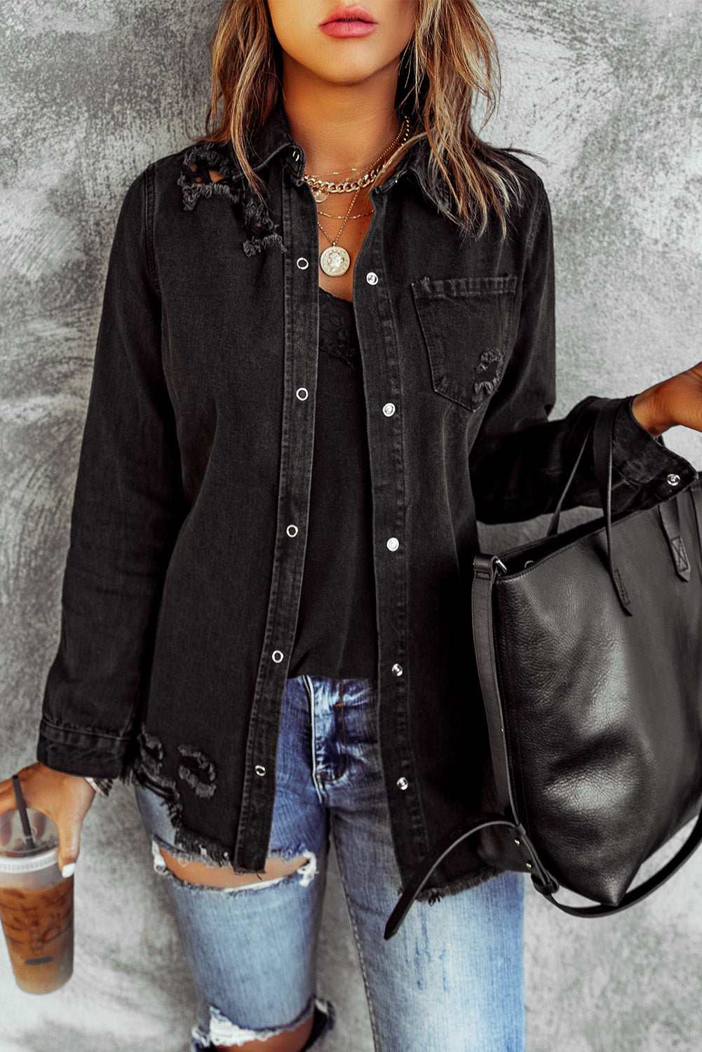 Woman in black denim snap down jacket