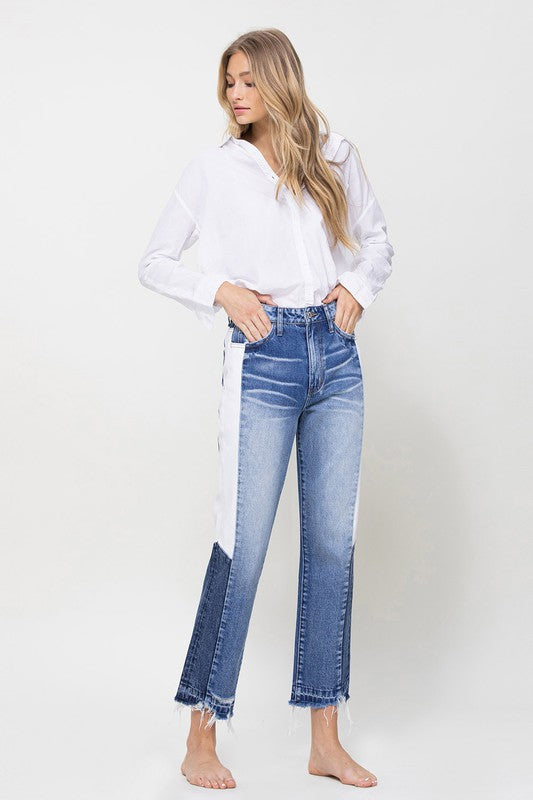 Woman in Jeans and blouse in front of white background 