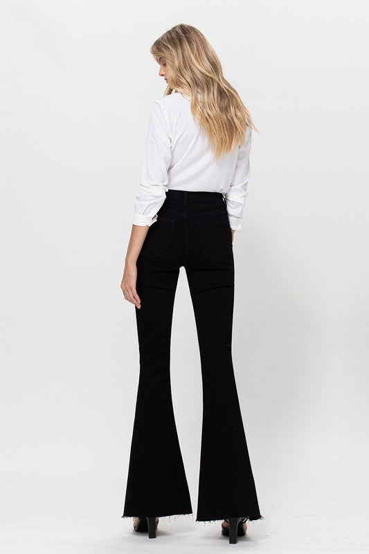 Woman in black jeans and white shirt