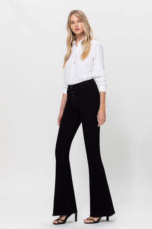 Woman in black jeans and white shirt