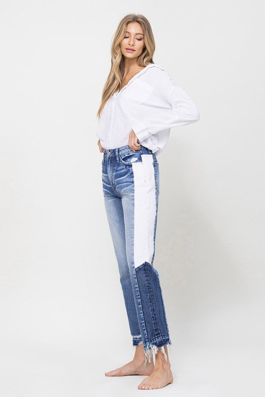 Woman in Jeans and blouse in front of white background 