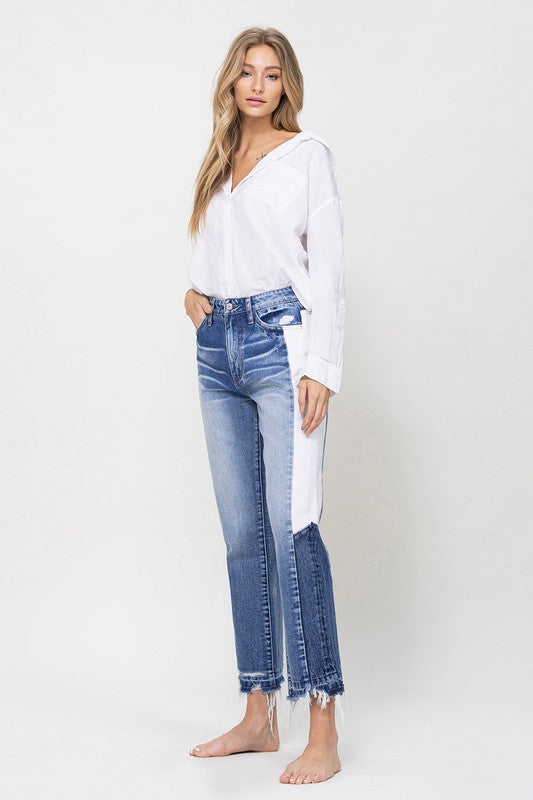 Woman in Jeans and blouse in front of white background 