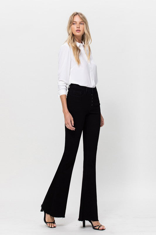 Woman in black jeans and white shirt