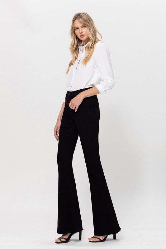 Woman in black jeans and white shirt