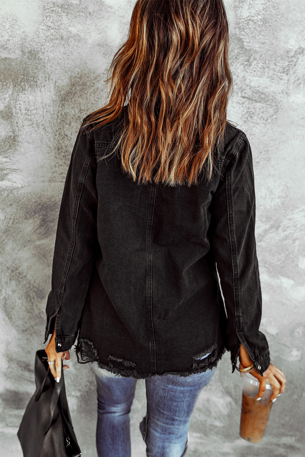 Woman in black denim snap down jacket