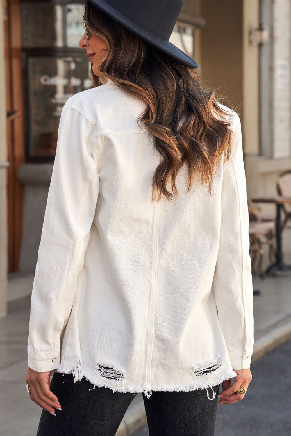 Woman in white snap down jacket