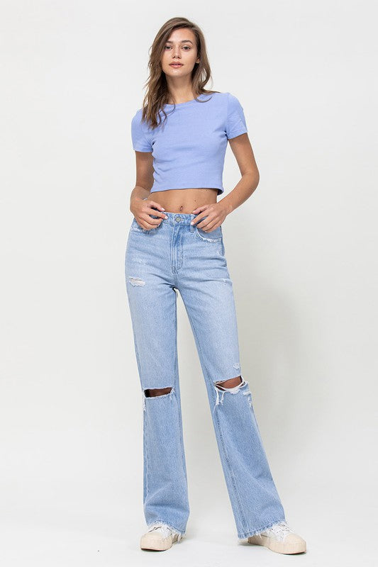  Woman with jeans on standing in front of white background