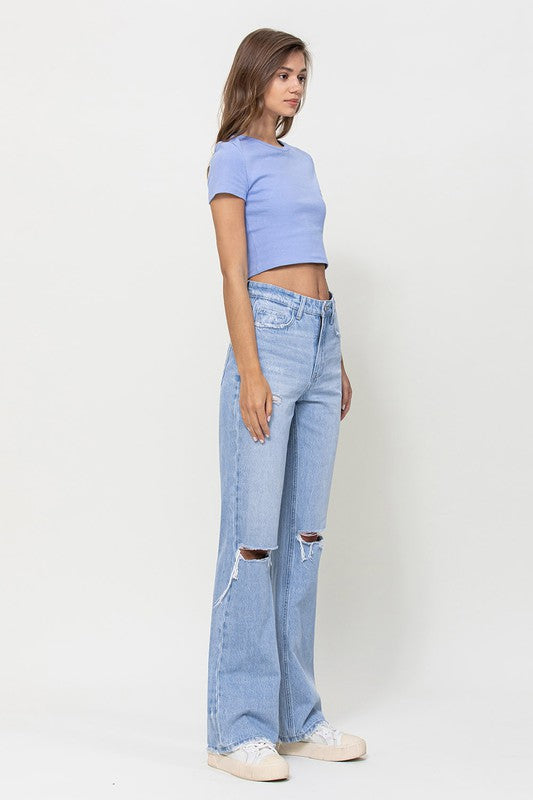  Woman with jeans on standing in front of white background