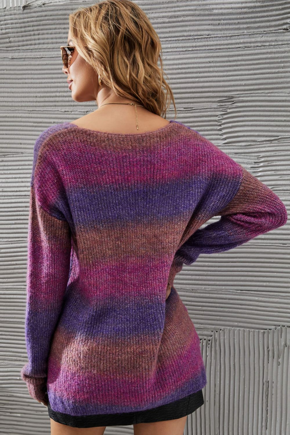 Woman in multicolored sweater