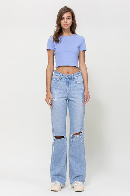  Woman with jeans on standing in front of white background