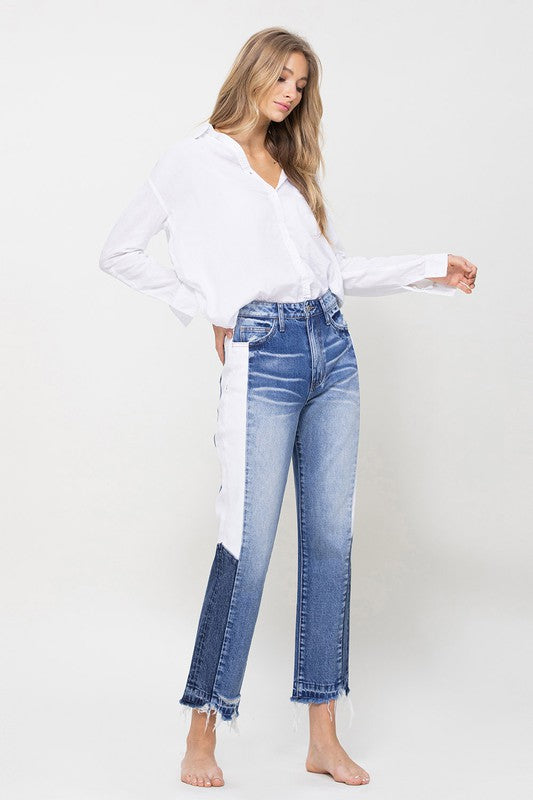 Woman in Jeans and blouse in front of white background 