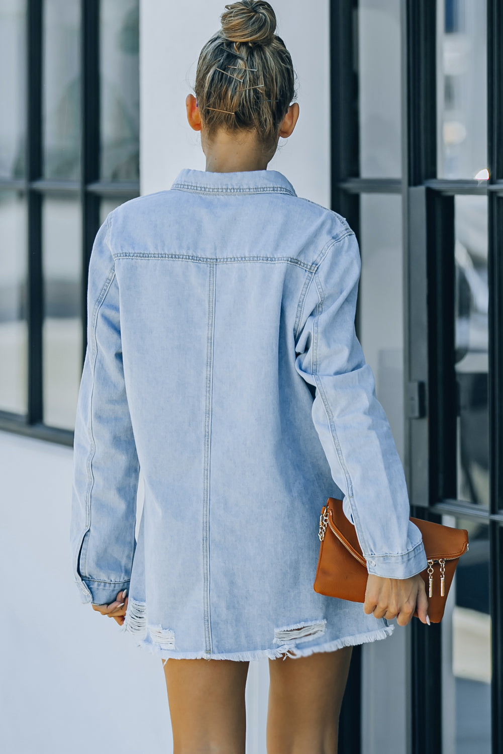 Woman in denim snap down jacket